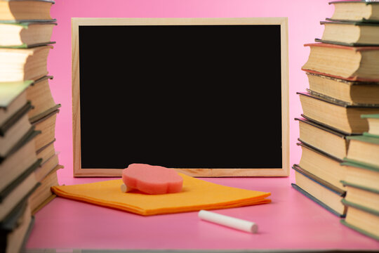 School books, white chalk and black board.