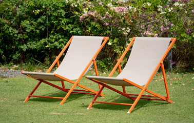 Empty two sun beds in a sunny garden