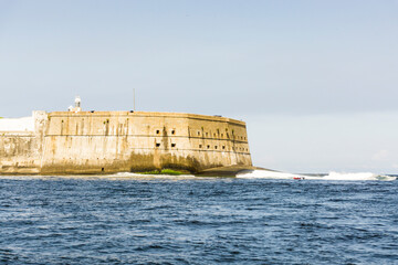 View from the sea of a fortification at entrance of Guanabara Bay, Niteroi City, State of Rio de Janeiro, Brazil.