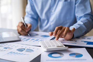 crop shot of image young man hand calculating monthly expenses finance and investment, accounting,...