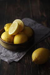 A bowl with yellow bright lemons