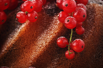 A cake with fresh red currant and tea