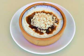 Baked rice pudding turkish milky dessert sutlac, keskul  (Turkish name; firin sutlac)