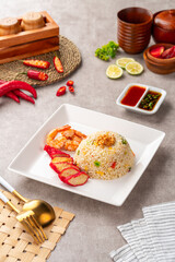 Fototapeta na wymiar Yangzhou fried rice is a popular Chinese-style wok fried rice dish. Asia Chinese China food cuisine. Authentic Yangzhou fried rice with egg, fresh prawn and Red Roast Pork.