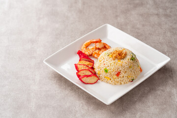 Yangzhou fried rice is a popular Chinese-style wok fried rice dish. Asia Chinese China food cuisine. Authentic Yangzhou fried rice with egg, fresh prawn and Red Roast Pork.