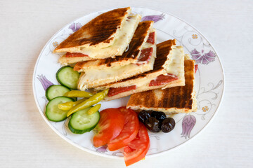 Turkish karisik atom  tost ( kasarli bazlama tost) . Flat baked bread toasted