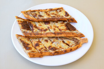 Kiymali pide. Turkish pide with minced meat. Turkish pizza mince pita Pide on white background. Etli ekmek. Kusbasi kasarli pide.