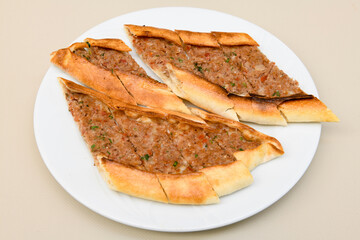Kiymali pide. Turkish pide with minced meat. Turkish pizza mince pita Pide on white background. Etli ekmek. Kusbasi kasarli pide.