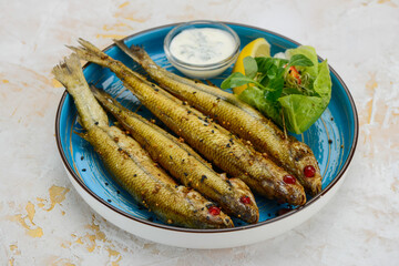 fried chihonya fish in a blue plate
