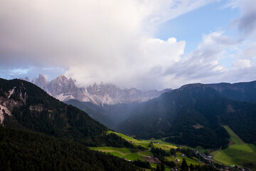 Sunset and rainbow in Val Di Funes, Dolomites, Alps, Italy