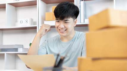 Man was happy after receiving an order from an internet customer, New business style for young people working at home and owning businesses, Online shopping SME entrepreneur, Packing box, Sell online.