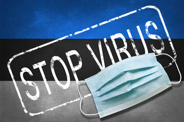 Lettering stamp Stop Virus and medical mask on Estonia flag. Return of the coronavirus. New jump in...