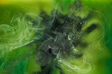 Liquid fluid art abstract background. Green dancing acrylic paints underwater, cosmic smoke ocean © amixstudio