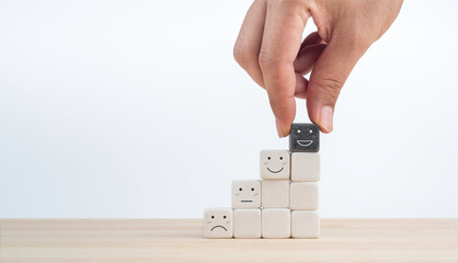 Feedback, client survey, customer experience satisfaction rating scale with emoticon face. Hand put...