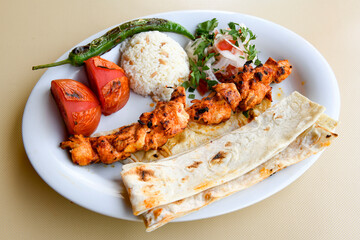 Chicken wings barbeque in a dish with BBQ grill sauce . Izgara tavuk kelebek sis kanat. Tavuk sis, gogus.