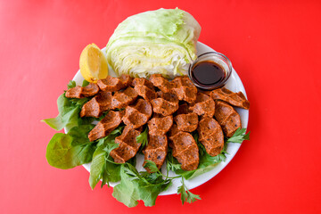 Steak a la turca or chee kofta on a plate( Cig Kofte )  - Turkish Food.