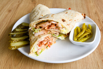 Lavash doner kebab ( zurna tavuk et doner durum )  or shawarma sliced in plate isolated. 