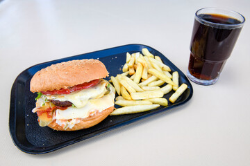 Big tasty burger with beef cutlet on a plate. Crispy chicken burger.