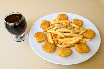 Fried Chicken breast hot crispy strips crunchy chicken tenders  isolated on white background.Nuggets isolated on white background on a plate
