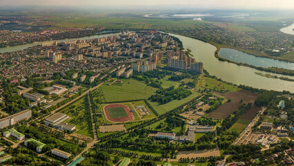 western outskirts of the city of Krasnodar (South of Russia) - the stadium of the agricultural university, the districts of Selkhoz, Novy Gorod and Yubileiny - aerial view panorama on a summerday