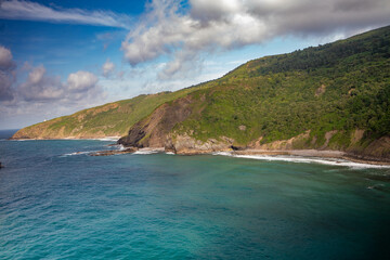 mountains next to the blue Caribbean ocean