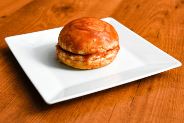 Big tasty burger with beef cutlet on a plate. Crispy chicken burger.