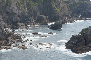 seaside cliffs and rocks with soft waves