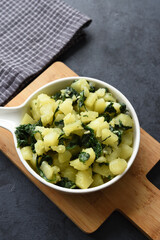 Boiled potatoes with spinach, garlic, and olive oil
