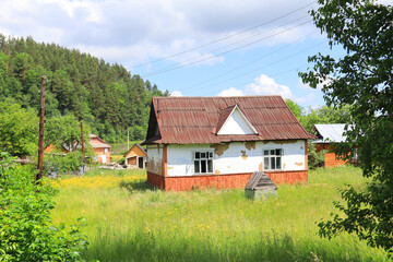 Fototapeta na wymiar Wooden house in sunny day in Yaremche, Ukraine
