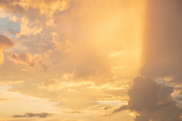 Golden sky background with clouds.