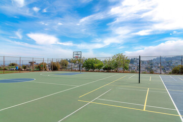 Multi-court outside in a residential area with mesh wall fence in San Francisco, California © Jason