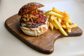 Big tasty  burger with beef cutlet on a plate. Hamburger.