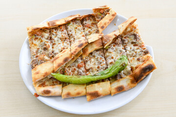 Turkish pita with minced cubed meat and cheese (Turkish name: Kiyma Kusbasi kasarli pide)