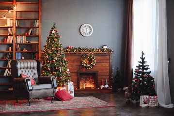 Christmas Dark Interior. Evergreen Christmas Tree with Red Decor. Fireplace, Armchair and Bookcase