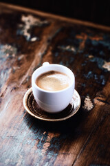 Cup of coffee on rustic wooden background. Close up. Copy space.