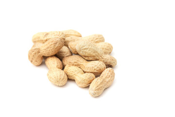 Organic peanuts in shell isolated on white background. Heap of peanut closeup