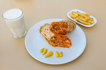 Lavash doner kebab ( zurna doner durum )  or shawarma sliced in plate isolated. 