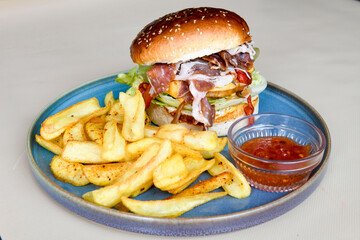 Big tasty  burger with beef cutlet on a plate. Hamburger.