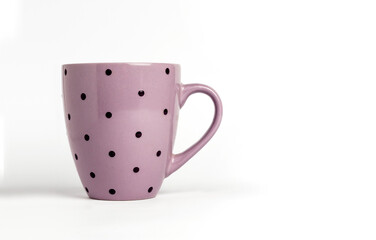 Purple dotted tea cup isolated on white background