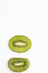 Fototapeta na wymiar Fresh and ripe sliced kiwi on the white background.