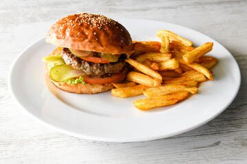 Big tasty  burger with beef cutlet on a plate. Hamburger.