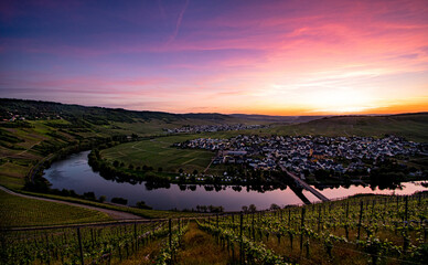 Far view over Mosel loop during spectacular colorful sunset near Leiwen, Germany