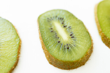 Fototapeta na wymiar slices of kiwi on white background