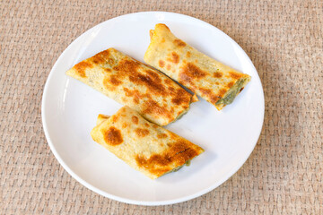 Lavash doner kebab ( zurna doner durum )  or shawarma sliced in plate isolated. 