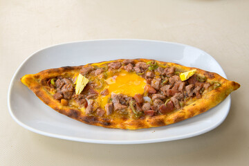 Turkish pita with minced cubed meat and cheese (Turkish name: Kiyma Kusbasi kasarli pide)