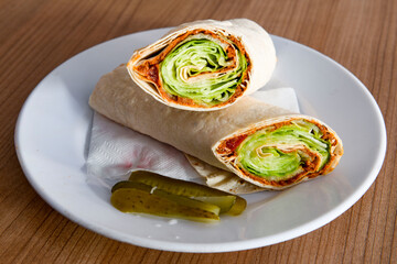 Traditional Turkish Raw Meat Wrap ( Turkish Name : Cig Kofte Durum ). Raw Meat in roll of bread lavash. Turkish food. 