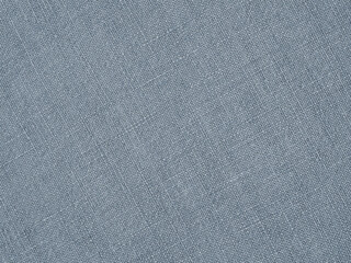 Fototapeta na wymiar Light blue woven surface close up. Linen textile texture. Fabric sewing background. Textured braided backdrop. Len wallpaper. Macro