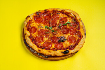 Creative layout of hot delicious pizza in flying on summer orange background. Pizza pepperoni design mockup flyer or poster for promotions and discounts with copy space. Fast Food concept.