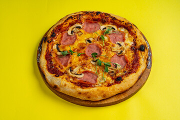 tasty pizza with chicken and mushrooms on a wooden board