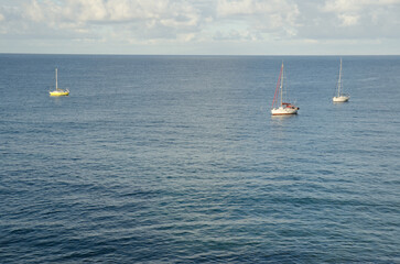 Fototapeta premium Yachts moored along the coast. Sardina del Norte. Galdar. Gran Canaria. Canary Islands. Spain.